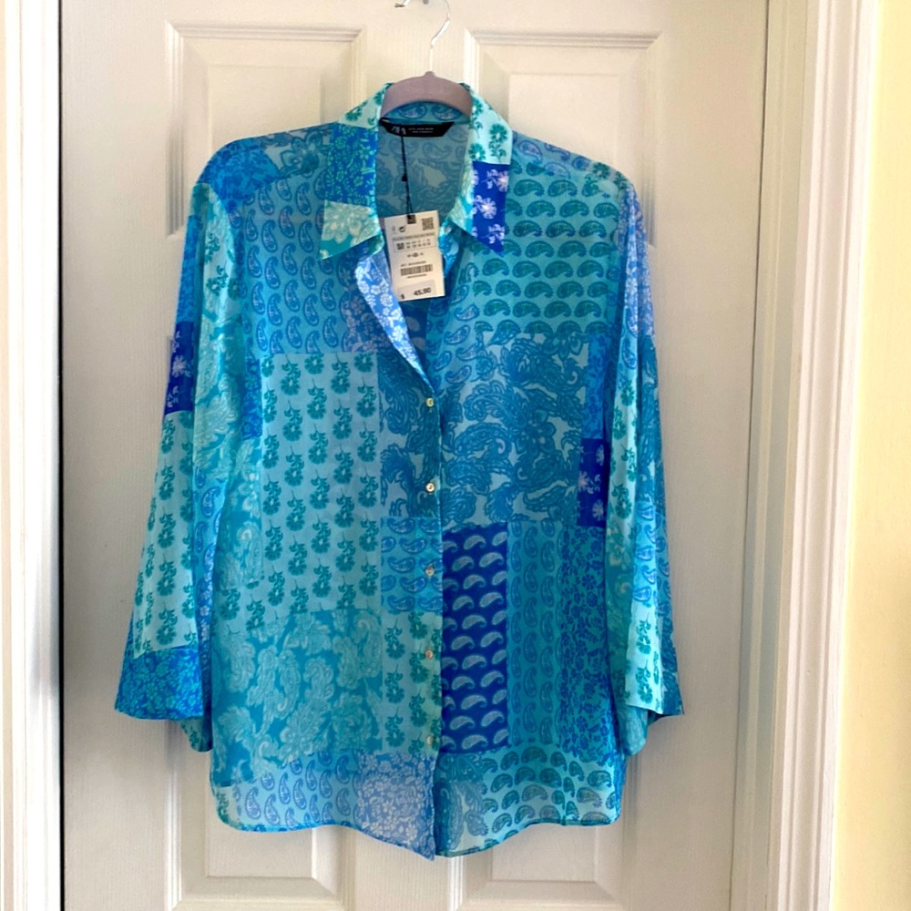 Blue paisley print blouse.